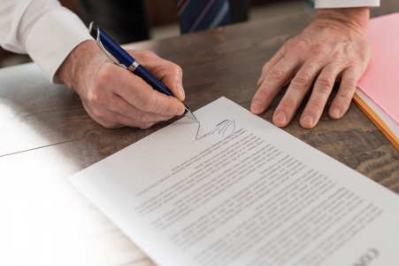 Man signing documents